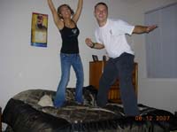 June 12, 07 - Jason's house party - suzy & jason jumping on the bed